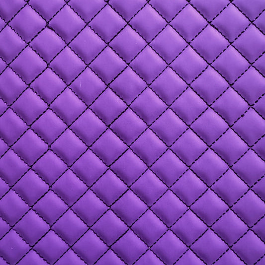 Close-up of purple quilted fabric with diamond pattern